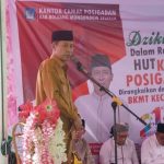 Bupati Bolsel Iskandar Kamaru saat memberikan sambutan pada acara HUT Kecamatan Posigadan ke-21, Selasa (16/1/2024), di halaman Kantor Camat Posigadan. Foto: Wawan Dengan/bolmong.news